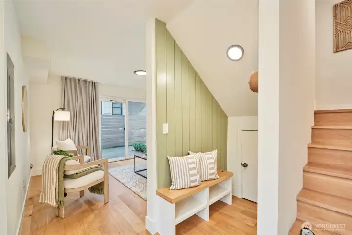 Immediately inside the front door you'll appreciate the modern farmhouse aesthetic, with shiplap accent wall, built in bench, under the stairs storage closet and real oak hardwoods.