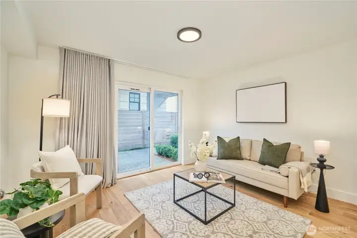 The entry level den/family room (in a townhome?!) is very spacious and has sliding doors to the adjacent outdoor patio.