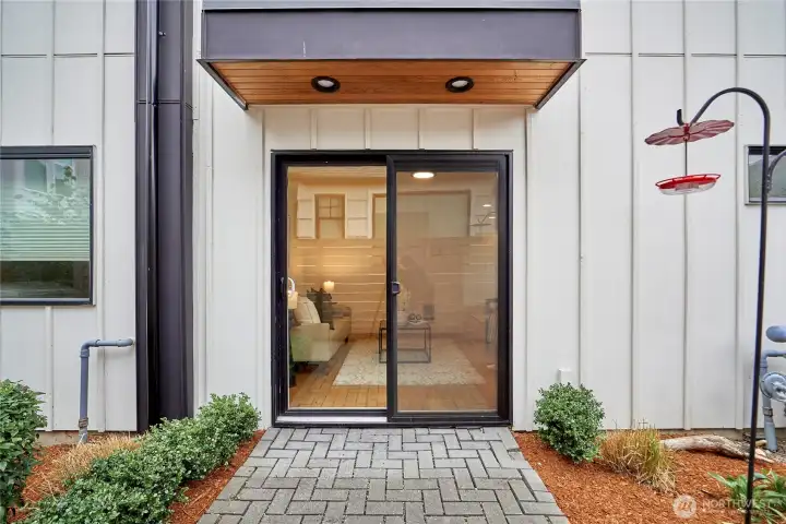 A look at the patio off the den/family room, one of 3 outdoor living spaces in the home.