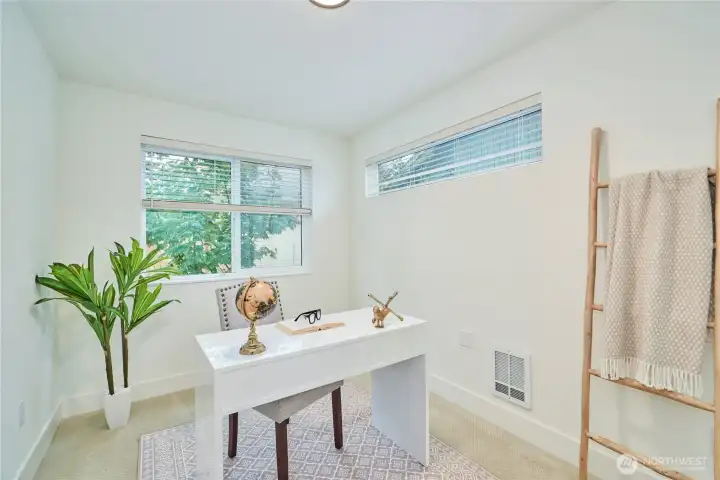 The entry level also features a bedroom that is currently staged as an office. The interior walls of the home have been recently painted and the carpets professionally cleaned.