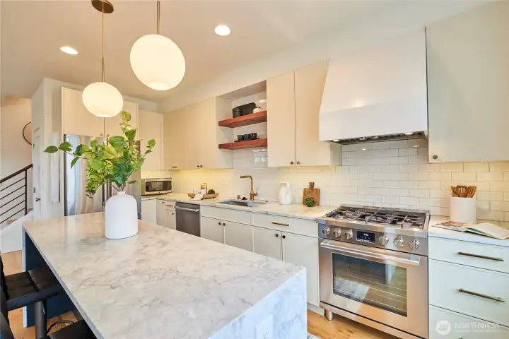 The West Elm lighting package continues in the kitchen and compliments the fixtures and handles perfectly.