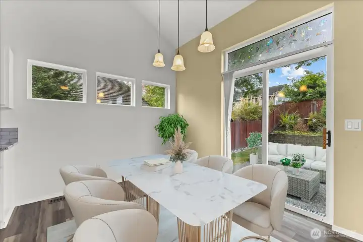 Dining area with a slider to the backyard & patio. Virtually staged.
