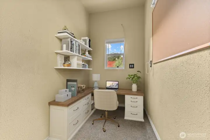 Small room in the garage w/ power. great for office, hobby rm or storage.