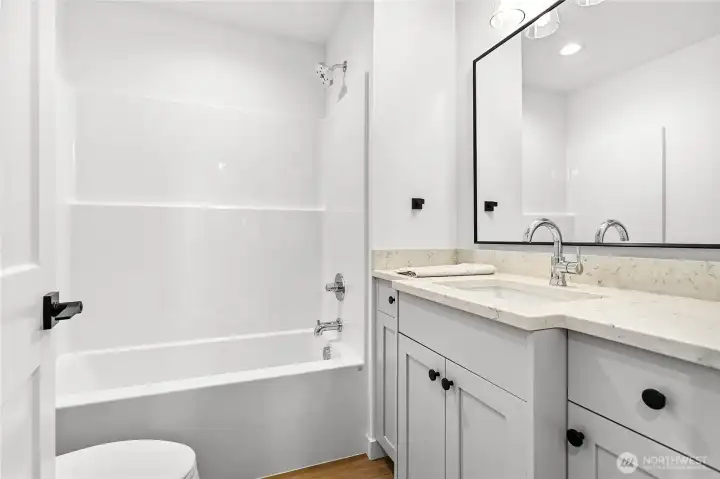 Downstairs you will find 2 bedrooms and 2 bathrooms.