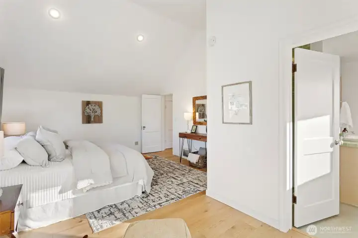 Connected to the bathroom(also with downtown and mountain views), the primary is a large bedroom with room for extra furniture and seating.