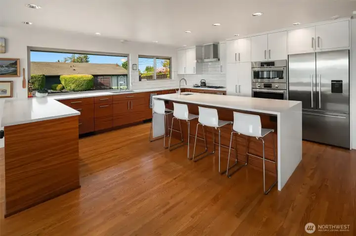Clean classic lines & new wood cabinets with quartz counters are enhanced by natural light