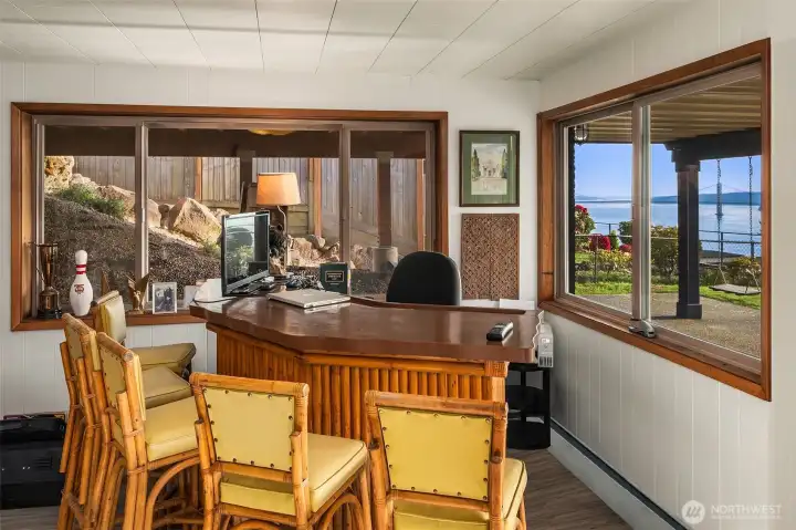 Lower level tiki bar is super fun and leads to patio, swings, hot tub or just playtime.