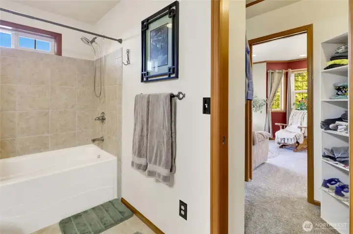 Double doors access the walk in closet (which includes attic storage!)