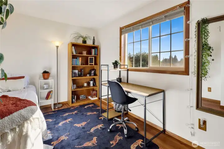 Bedroom 4 overlooks the side yard.