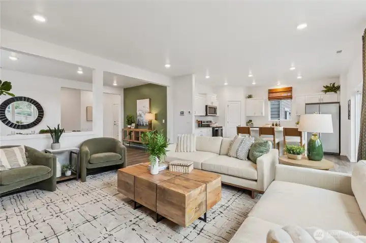 Large great room with plenty of seating space. Actual home is under construction and finishes, colors, and materials may vary. See site agent for details.