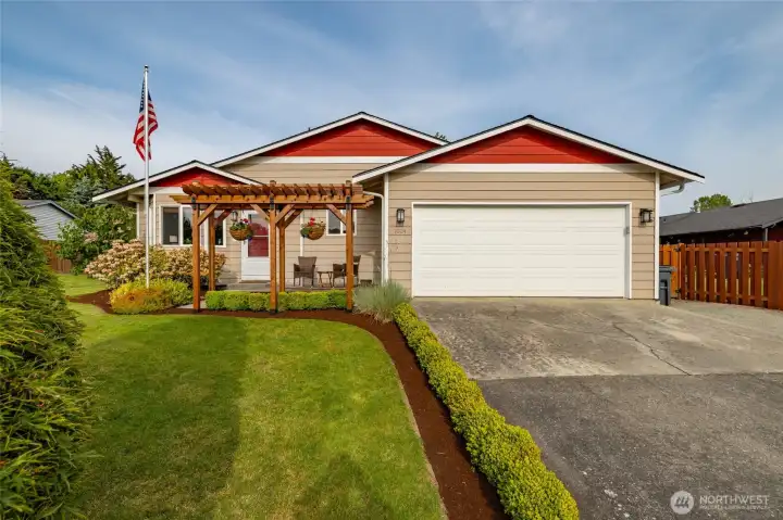 Attached two car garage actually fits two cars!  Plus bonus gravel parking area next to driveway/house.