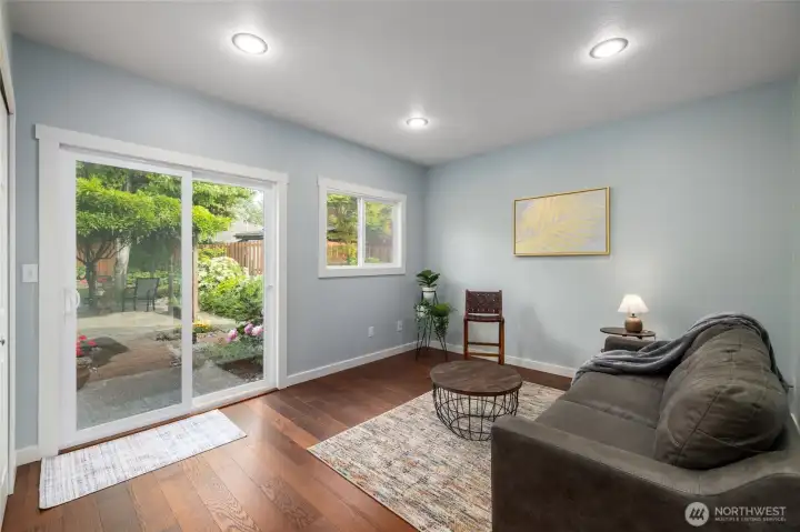 The family room provides bonus living area, and a slider to the beautiful back yard.
