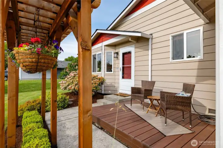 Your sunny west-facing front porch, with cedar pergola for privacy and color.