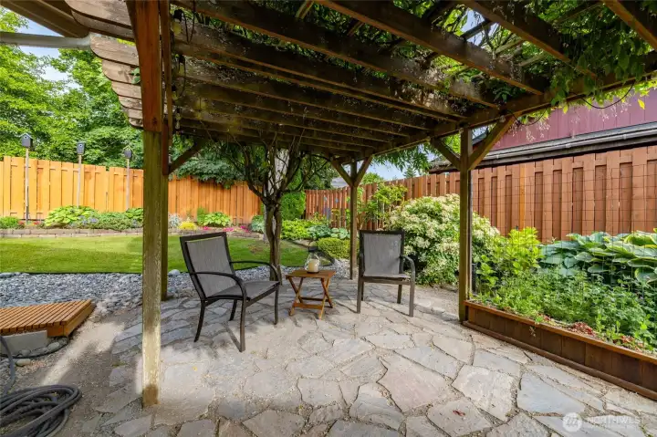 The wisteria patio, with stone floor.  The perfect spot for al fresco dining, or a cozy coffee for two.