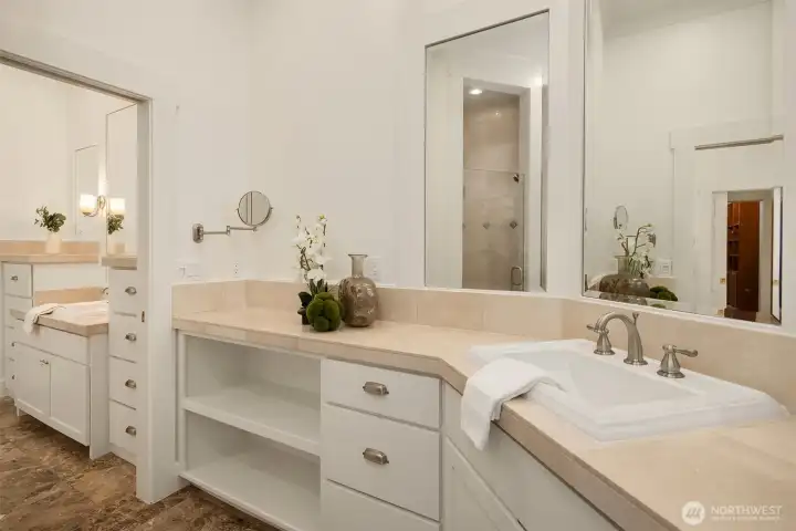 Every surface speaks to quality - marble counters, custom cabinetry, and thoughtful details throughout the primary bath.
