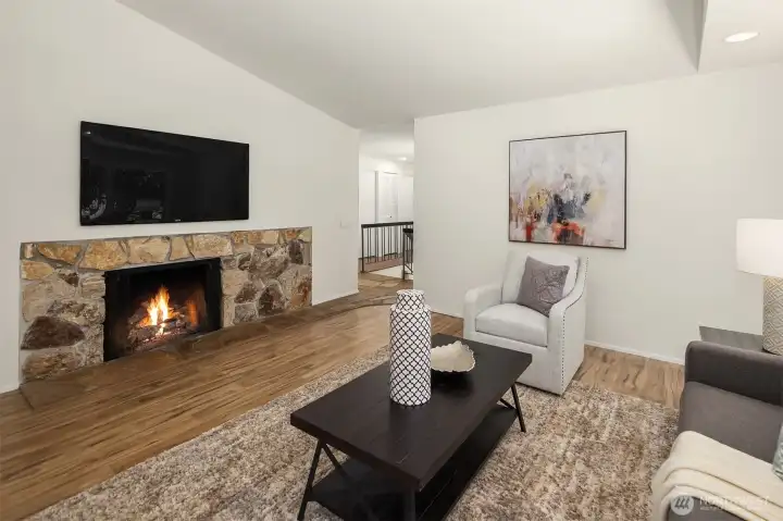 A striking stone fireplace anchors the room.