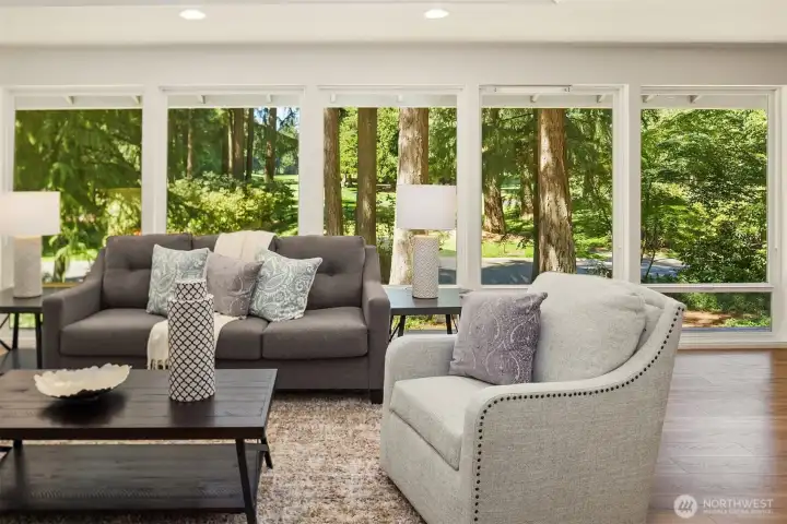 Expansive windows frame beautiful golf course views.