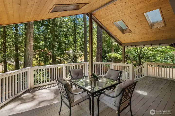 Skylit covered deck expands the living space outdoors.