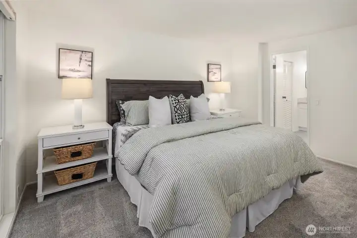 Another view of the spacious primary bedroom with a private bath.