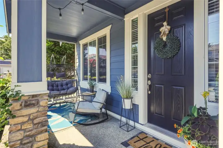 Covered front porch draws you in; fresh exterior paint and sidelights flanking the front door say WELCOME!