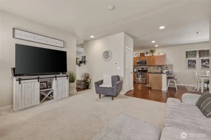 The open floor plan provides a spacious area for everyday living; this family room is the large main floor gathering space and is both comfortable and pretty.