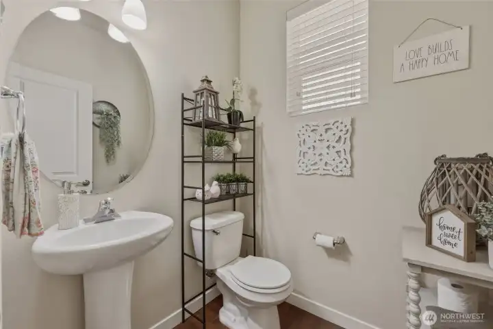 Main floor guest bath has pedestal sink and high window--light and ventilation while maintaining privacy!