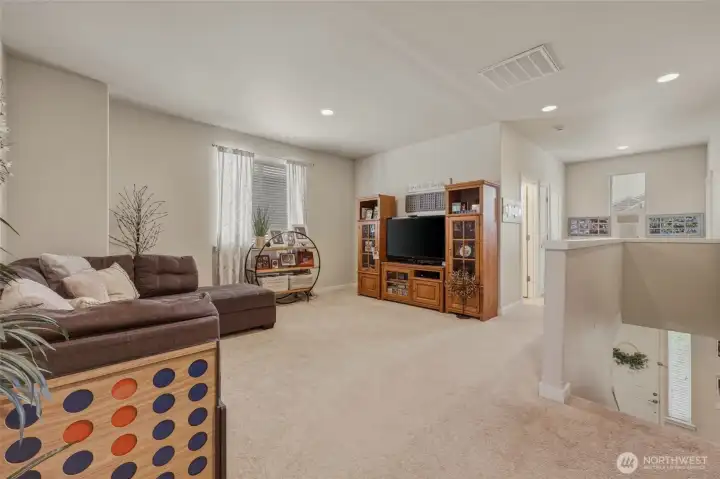 Amazing space in this upstairs loft/bonus room, providing a comfy and roomy area to relax.