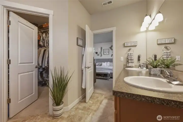 Walk-in-closet provides tons of storage that tucks away out of sight, but is so convenient right inside the bathroom!