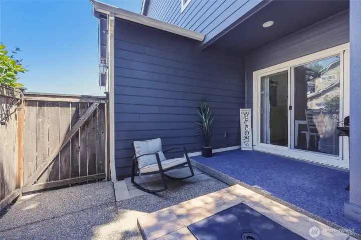 Gate here leads to driveway/garage door; an easy back door entrance.  Covered area has recessed lighting.