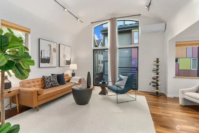 Lovely large living room with vaulted ceilings and tons of natural light