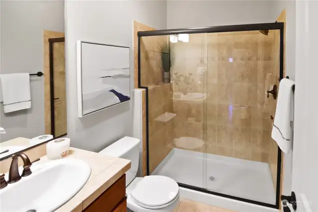 Main level Bathroom has a shower to serve the guest bedroom or your dinner guests.