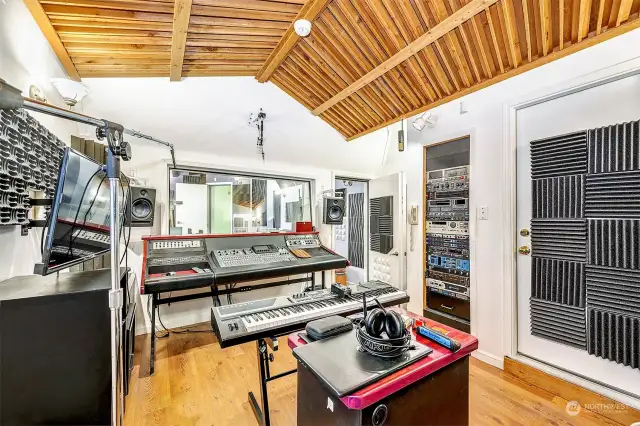 Inside of the recording studio, with a private door to the lower level bedroom or office.