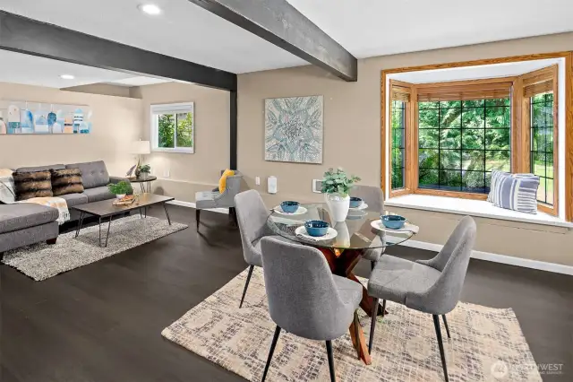 Beautiful Bay Window with seating, dining area, and living area.