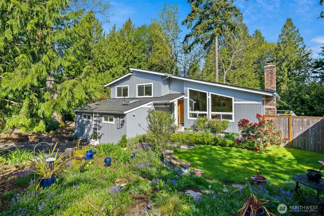 Incredible home on a lovingly landscaped .65 acre private lot.
