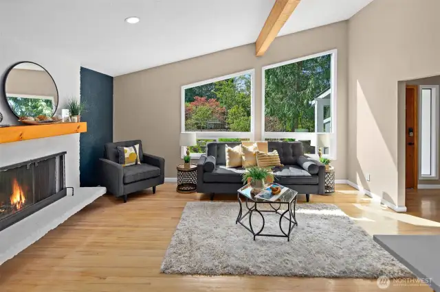 Soaring ceilings, expansive view windows, & skylights create a bright, airy ambiance.