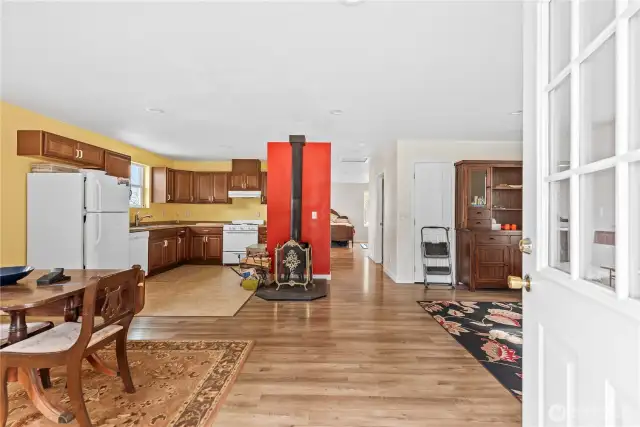 main living space - you can see hallway with bathroom and laundry area leading to bedroom