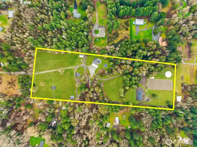 14 Acres, 19 stalls, 15 fields, arena, house and covered round pen, Shops, carports, flex room, chicken coop, storage