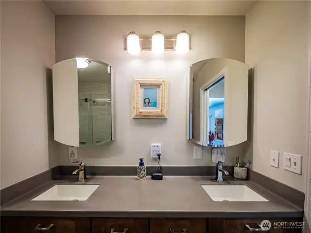 PRIMARY BATH...DUAL SINKS AND BIG SHOWER BEHIND... CORIAN COUNTER TOPS