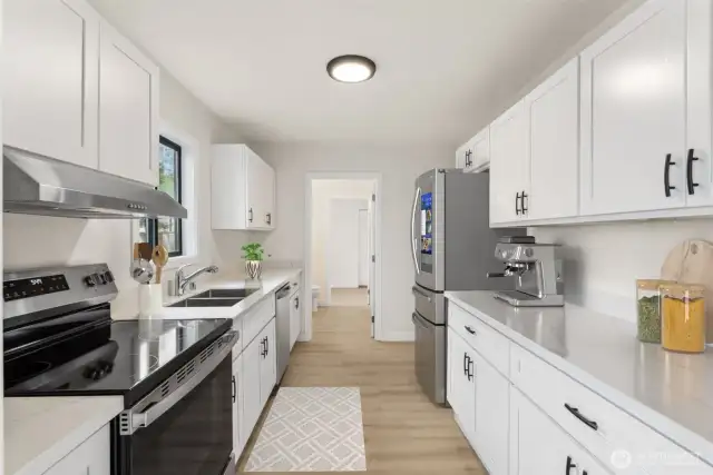 Virtually Staged. Kitchen updated with quartz counters and craftsman cabinets.