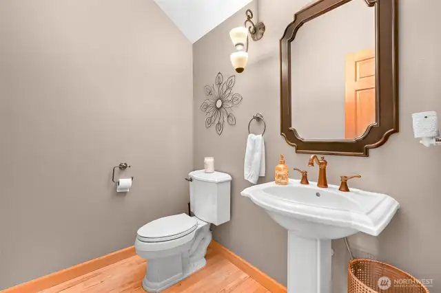 Powder bathroom next to the living area and bonus room.