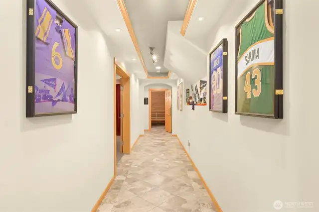 Hallway downstairs leading the the home theater, gym, and sauna.