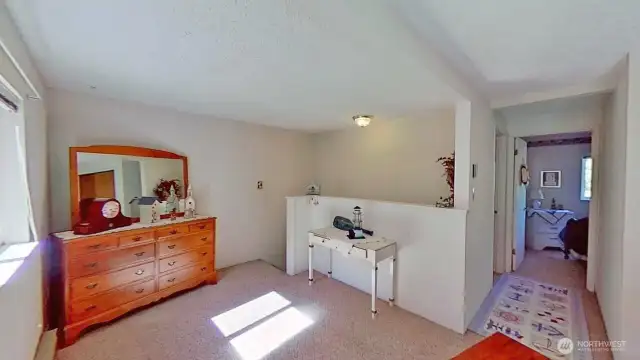 Upper level features a loft and two additional rooms.