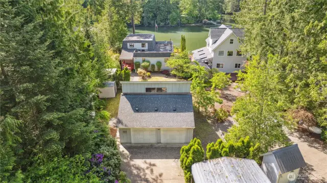 Property includes main house, detached garage with shop & bonus room above, carport, & garden shed.