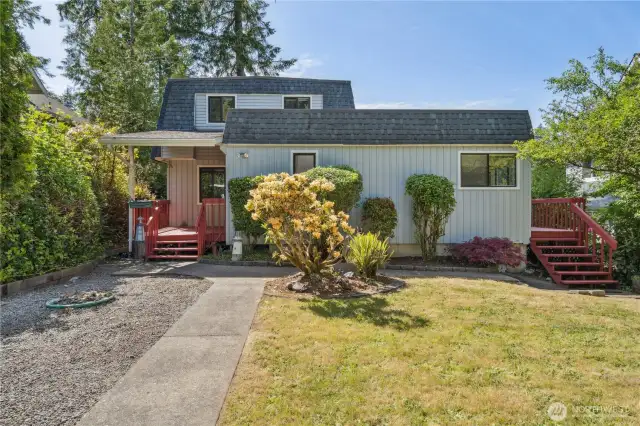 Quaint waterfront home with 2 bedrooms, 1.5 baths, kitchen, dining area, living room, loft, and extra room for office, etc.