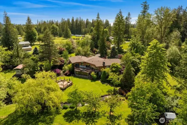Welcome to your private paradise—lush 7-acre gated estate with park-like grounds and endless possibilities.