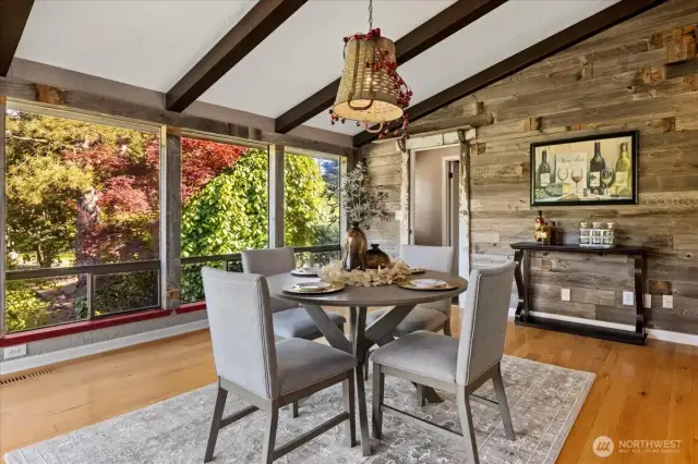 Kitchen eating space with large windows Door to the right leads to junior en-suite.