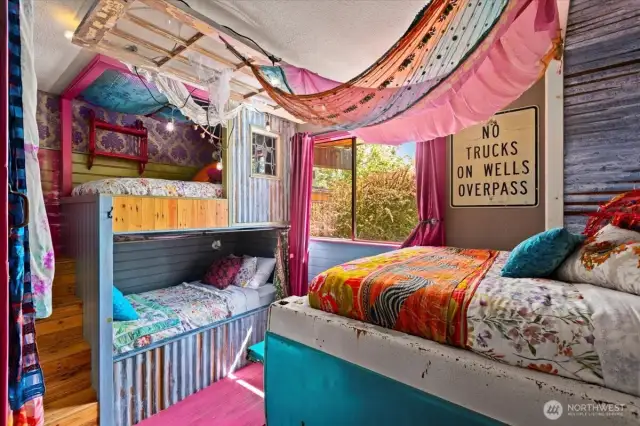 Second bedroom features handcrafted built-in bunk beds, combining cozy comfort with stylish charm.