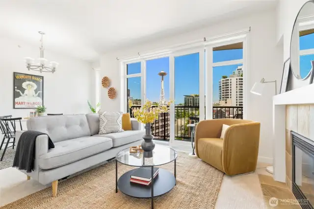 This home on the 11th floor of the Vine is the epitome of Seattle lifestyle-- The Space Needle out your window, Pike Place Market down the street (also visible from your balcony!)