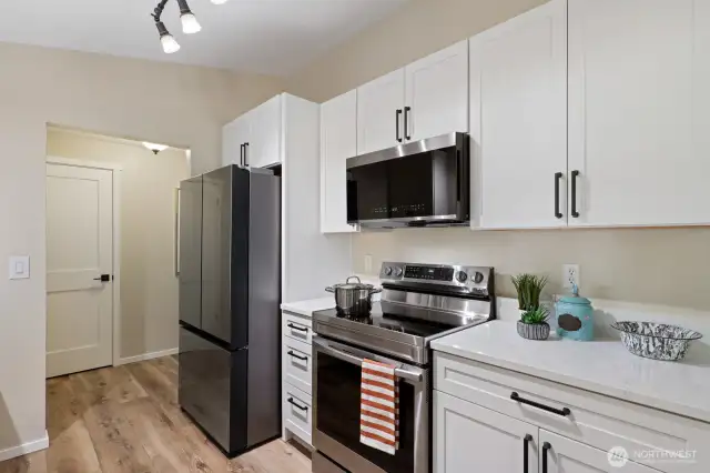 Modern appliances, beautiful cabinetry, and custom inset pull-outs allow for easy access to all your goodies.
