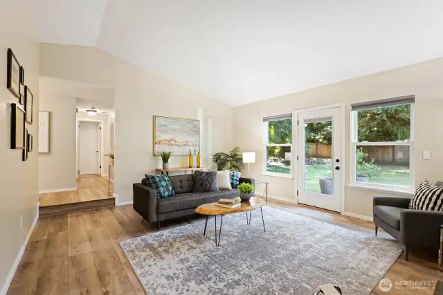 The main living room, opening out to the patio and incredible backyard offers plenty of space to spread out and relax